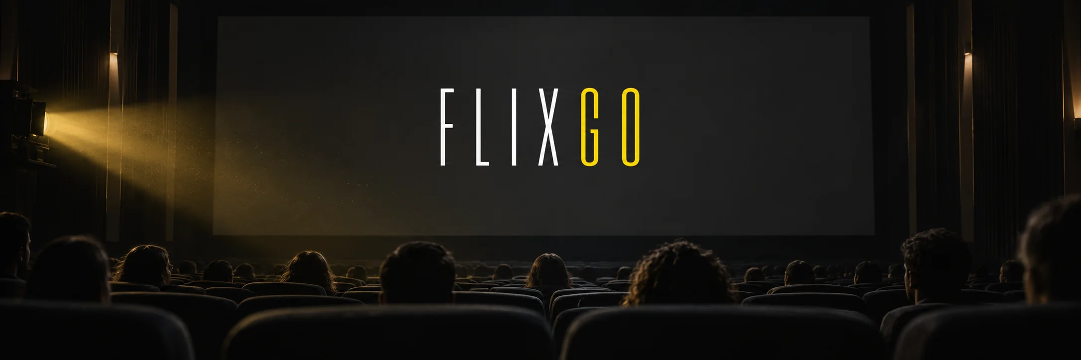 FLIXGO in thin white and yellow letters on a cinema screen with a warm projector beam